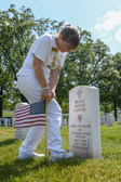 Gold Star Mother National President Jo Ann Maitland places flag at Vietnam MOH Bruce Wayne Carter’s headstone in Section 60.
